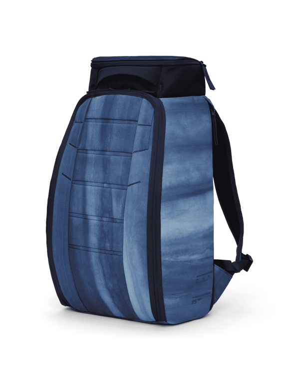 Db Hugger Backpack 25L in textured ultraviolet blue, shown from a three-quarter angle.