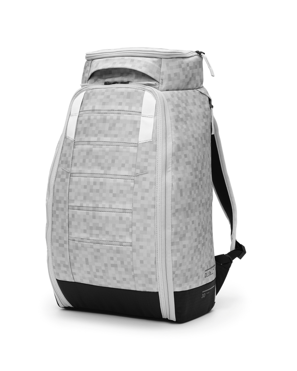 Db Hugger Backpack 30L in White Noise pixel pattern, shown from a front three-quarter angle.