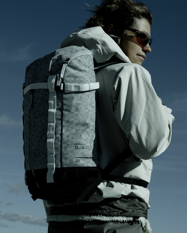 Db Backcountry Backpack 20L in White Noise worn outdoors against a clear sky.