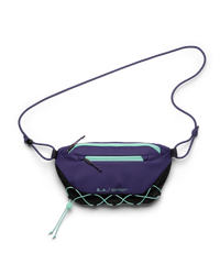 Db Roamer Pro 6L sling bag in black and purple with teal zippers and elastic bungee cord.