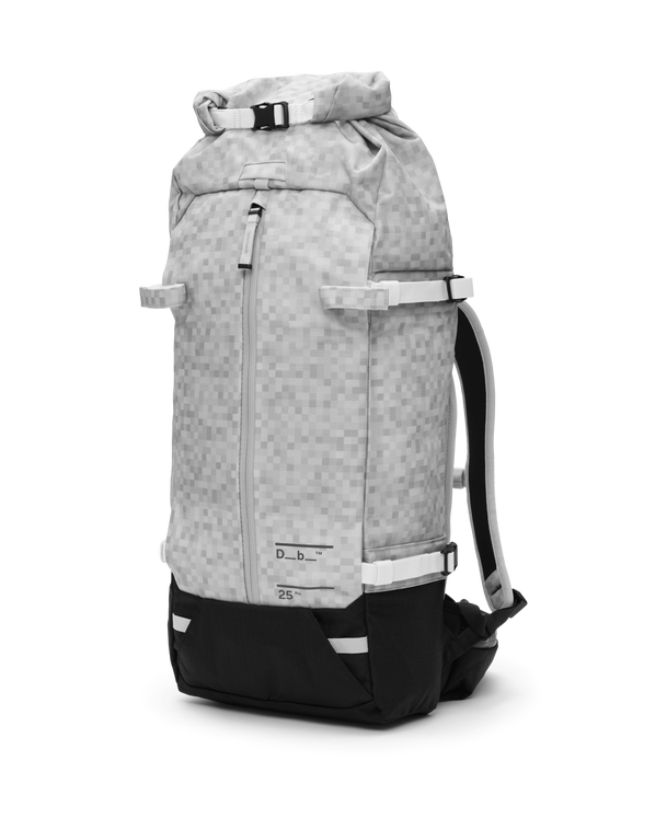 Front three-quarter view of the Db Snow Pro Backpack 25L in White Noise pattern.